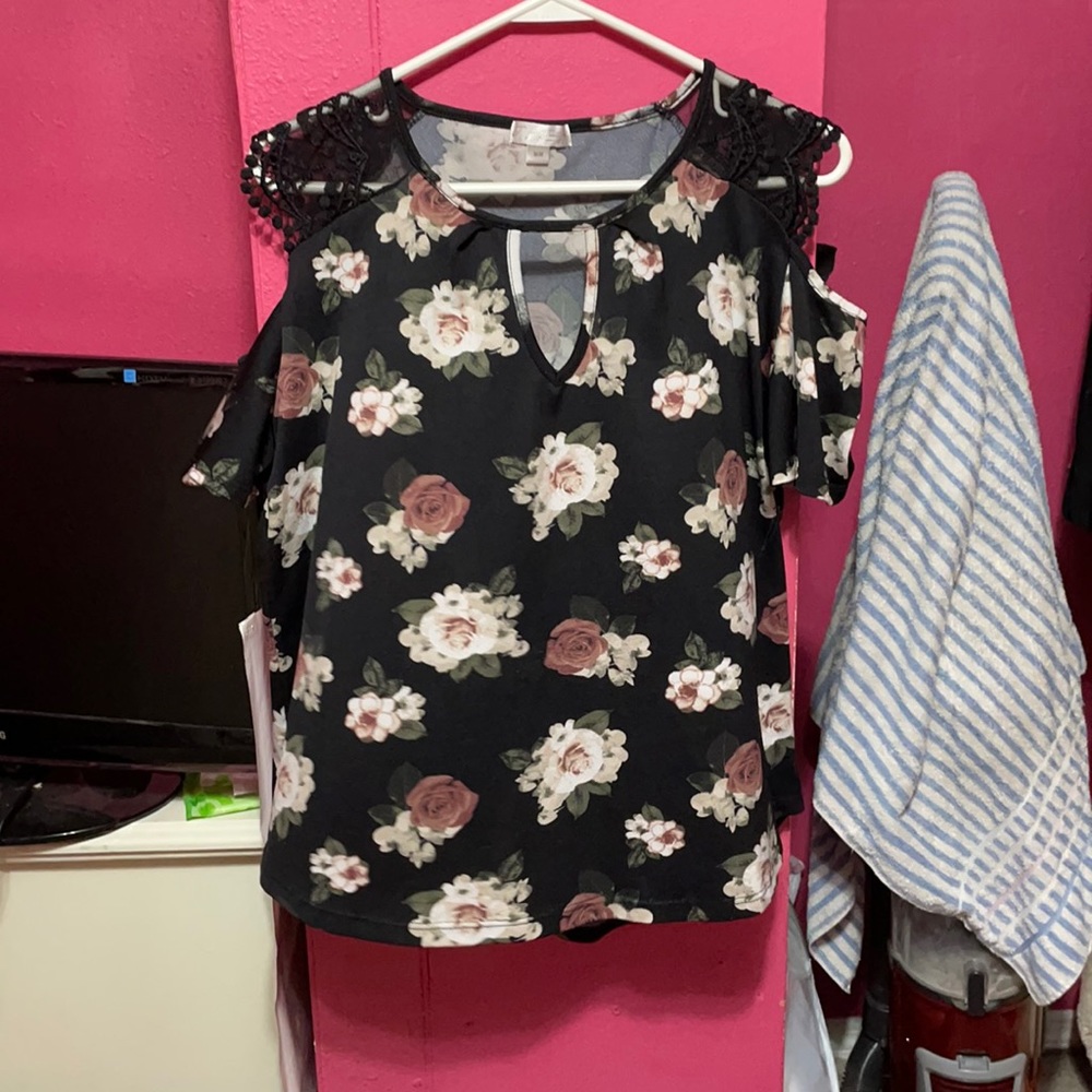 It’s a black blouse with flowers